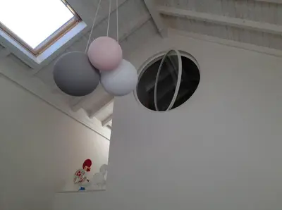 a room with spheres hanging from a ceiling at Casa Braancamp - Beautiful & Calm in Porto