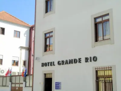 a white building with the words hotel grande rio at Hotel Grande Rio in Porto