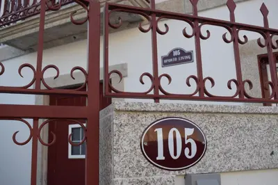 a sign on the side of a building at Oporto Living Apartments in Porto