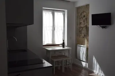 a kitchen with a sink and a window at Oporto Living Apartments in Porto