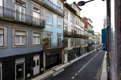an empty street in a city with buildings at Calm In Formosa in Porto