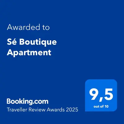 a blue sign with the text awarded to seoutine appointment at Sé Boutique Apartment in Porto