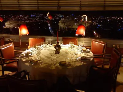 a table with wine glasses and a view of a city at Hotel Miradouro in Porto