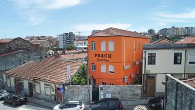an orange building with the words reach market on it at Peach Hostel & Suites in Porto
