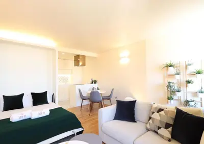 a living room with a couch and a table at HM - Ribeira São João 5K in Porto
