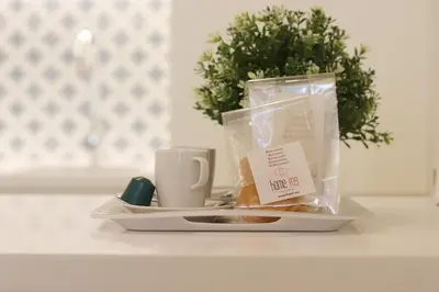 a tray with a plate of food and a coffee mug at HM - Ribeira São João 5K in Porto
