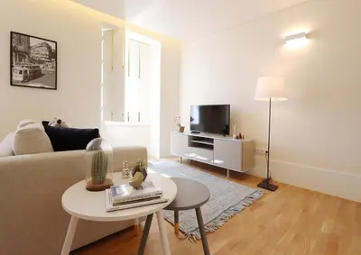 a living room with a couch and a table at HM - Ribeira São João 5K in Porto