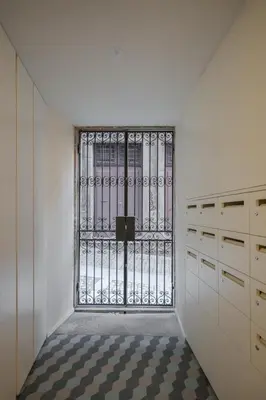 a room with a door with a checkered floor at HM - Ribeira São João 5K in Porto