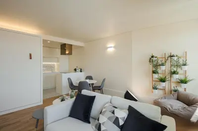 a living room with a couch and a table at HM - Ribeira São João 5K in Porto