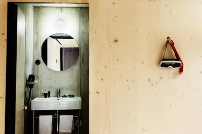 a bathroom with a sink and a mirror at Zero Box Lodge Porto in Porto