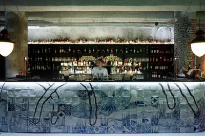a bar with a lot of bottles of alcohol at Zero Box Lodge Porto in Porto