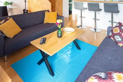 a living room with a table and a couch at LovelyStay - Oren Duke's House in Porto