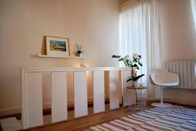 a white crib in a room with a window at Casa Braancamp II - Chic & Sweet in Porto