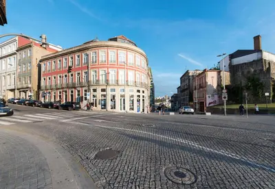 a large building on a street in a city at Light Blue Apartment in Porto