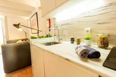 a kitchen with a sink and a counter top at Guest H4U - Bonjardim Terrasse Center in Porto