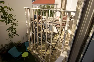 a book sitting on a table next to a camera at Guest H4U - Bonjardim Terrasse Center in Porto