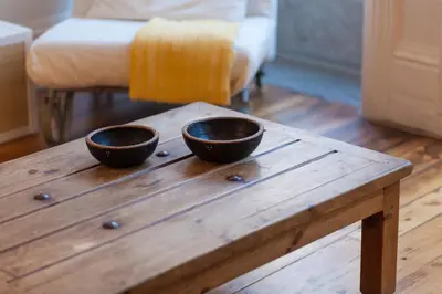 two bowls sitting on top of a wooden table at Loft Ribeira - 3px - Spacious Flat in Porto