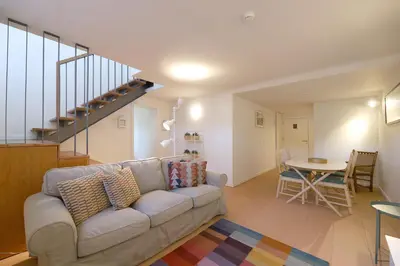 a living room with a couch and a table at FLH Oporto Captain House in Porto