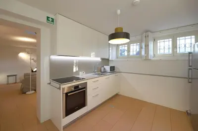 a kitchen with a sink and a stove top oven at FLH Oporto Captain House in Porto