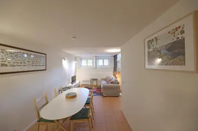 a dining room with a white table and chairs at FLH Oporto Captain House in Porto
