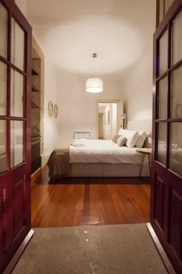 a bedroom with a bed in a room at Citybreak-apartments Patio in Porto