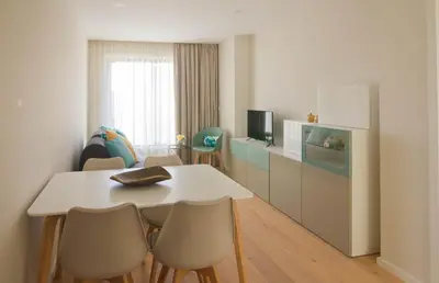 a living room with a white table and chairs at MH Duo in Porto