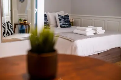 a bedroom with a bed with towels on it at Best Of Porto Apartment - BOP in Porto