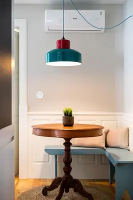 a dining room table with a potted plant on it at Best Of Porto Apartment - BOP in Porto