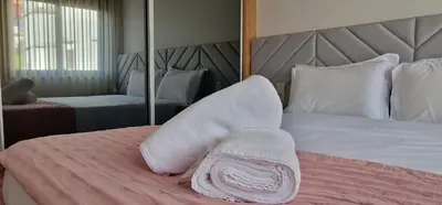 a bedroom with a bed with white sheets and pillows at Alma Invicta Alegria in Porto