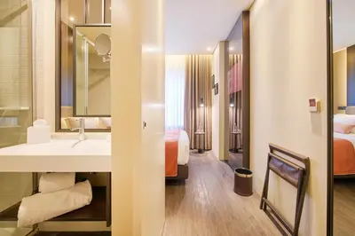 a hotel room with a sink and a bed at Hotel Moon & Sun Porto in Porto