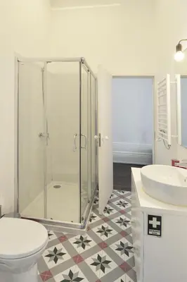 a bathroom with a shower and a toilet and a sink at FLH Porto Elegant Flat with Terrace in Porto