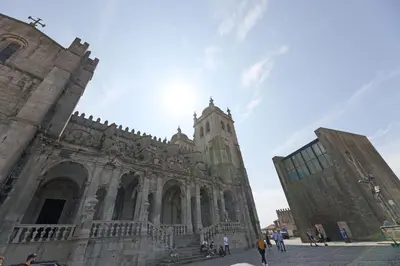 a large building with a clock tower on it at FLH Porto Elegant Flat with Terrace in Porto