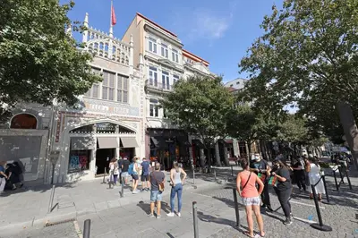 a group of people standing on a street in front of a building at FLH Porto Elegant Flat with Terrace in Porto