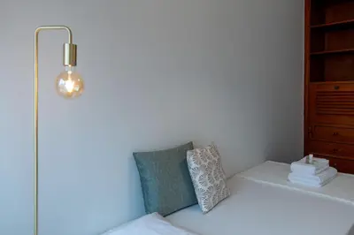 a room with two pillows and a lamp and a shelf at OPO Bolhao Flats by Destiny Houses in Porto