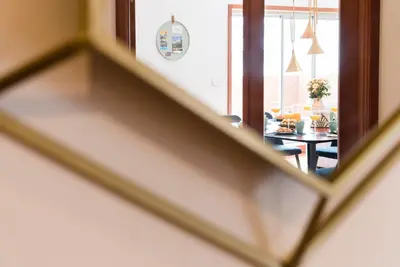a view of a living room through a mirror at GuestReady - Jazz Apartment in Porto
