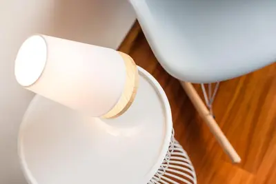 a cup sitting on top of a white chair at GuestReady - Jazz Apartment in Porto