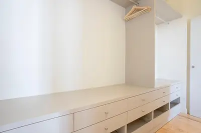 a dressing room with white walls and a shelf at Downtown Spacious Studio in Porto