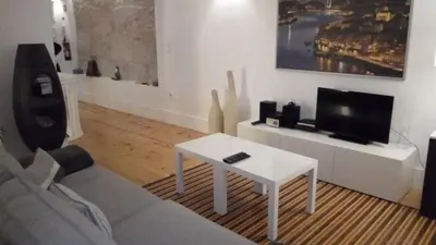 a living room with a couch and a table at Oporto City View - Wonderful Apartment in Porto