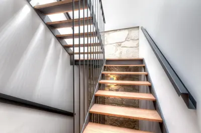 a staircase in a house with metal railings at InPatio Guest House in Porto