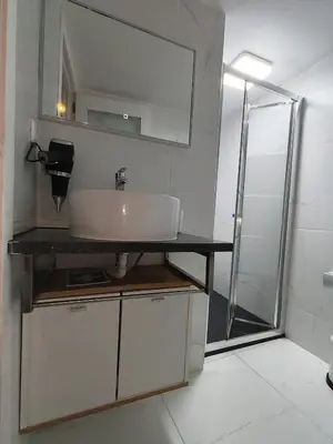 a bathroom with a sink and a shower at Central Apartamento 0 AC Metro Nearby in Porto