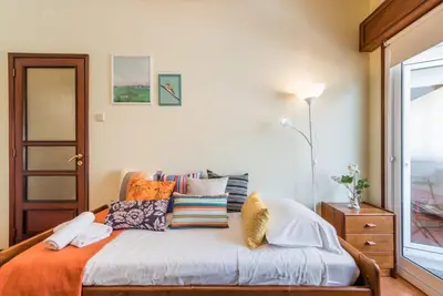 a bedroom with a bed with pillows on it at GuestReady - Sweet & Relax Flat in Porto