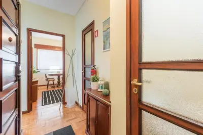 a hallway with a door and a dining room at GuestReady - Sweet & Relax Flat in Porto