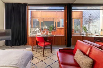 a bedroom with a bed and a table and a couch at Hotel Tipografia do Conto by Casa do Conto in Porto