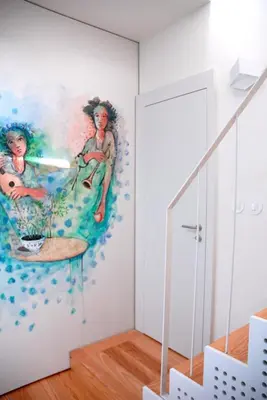 a room with a painting on the wall at Amazing City Center Apartment Porto Villa Lóios in Porto