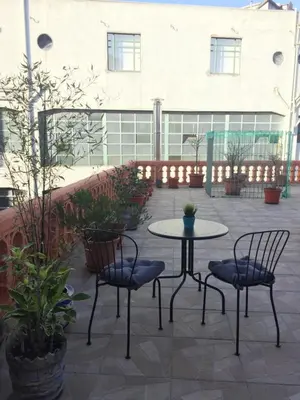 a patio with a table and two chairs and a table at HaoBo Porto Center in Porto