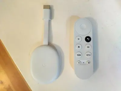 a remote control hanging on a wall next to a toilet at Santa Catarina Patio Apartment - with washer machine in Porto