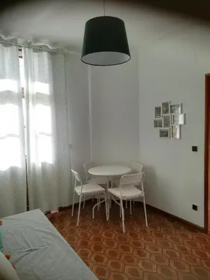a room with a table and chairs and a bed at Oportobestview in Porto