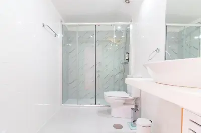 a bathroom with a shower and a toilet and a sink at ON Apartments - Palace - Free Parking in Porto