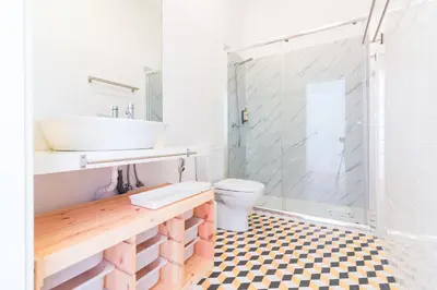 a bathroom with a sink and a toilet and a shower at ON Apartments - Palace - Free Parking in Porto