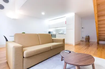 a living room with a couch and a table at ON Apartments - Palace - Free Parking in Porto